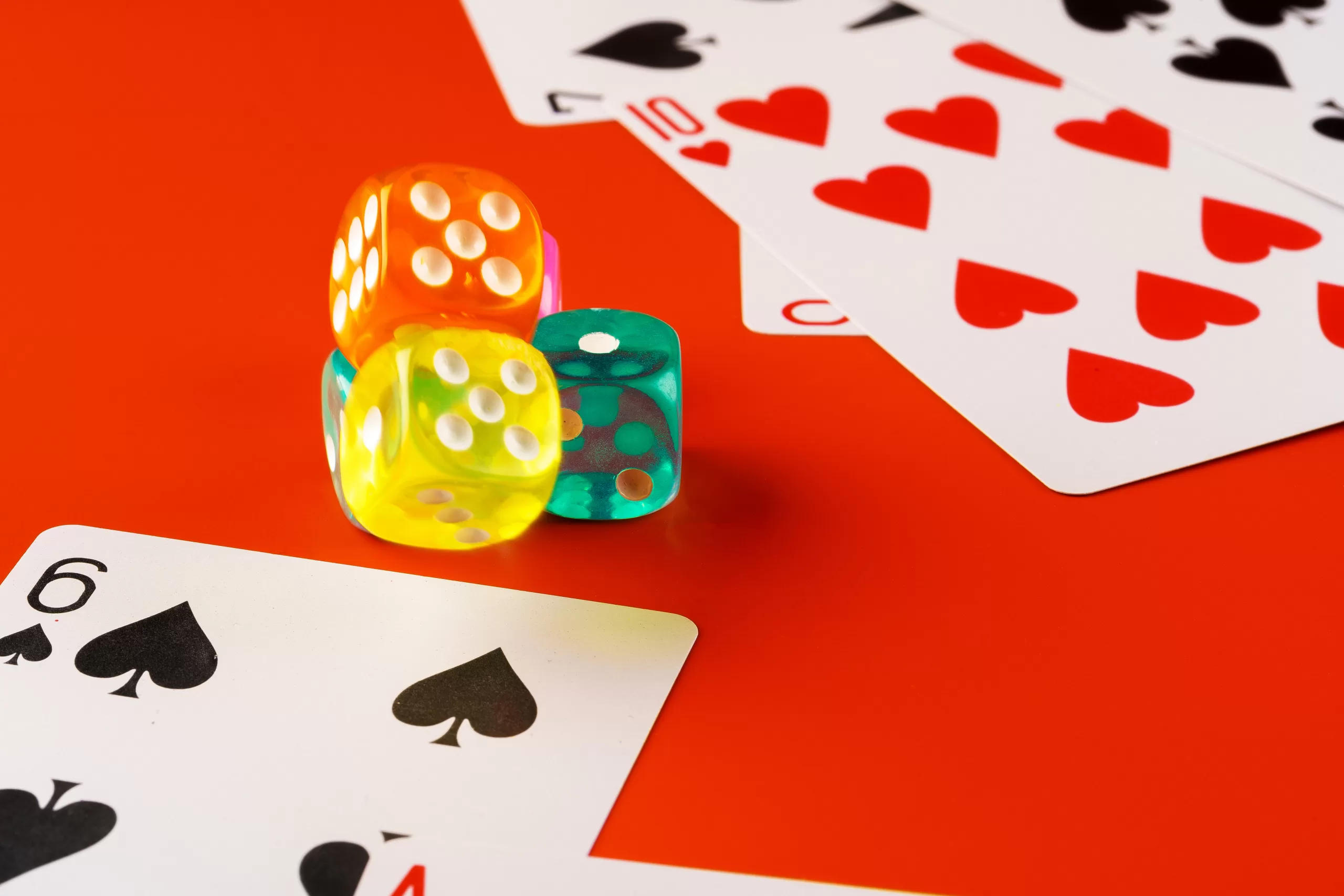 dice and cards scattered on table close up