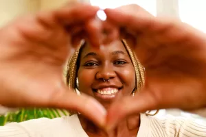 hispanic woman showing love with hands in heart sh 2022 09 07 18 08 04 utc 1 scaled
